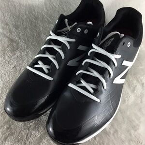 New Balance Men's Black baseball cleats.